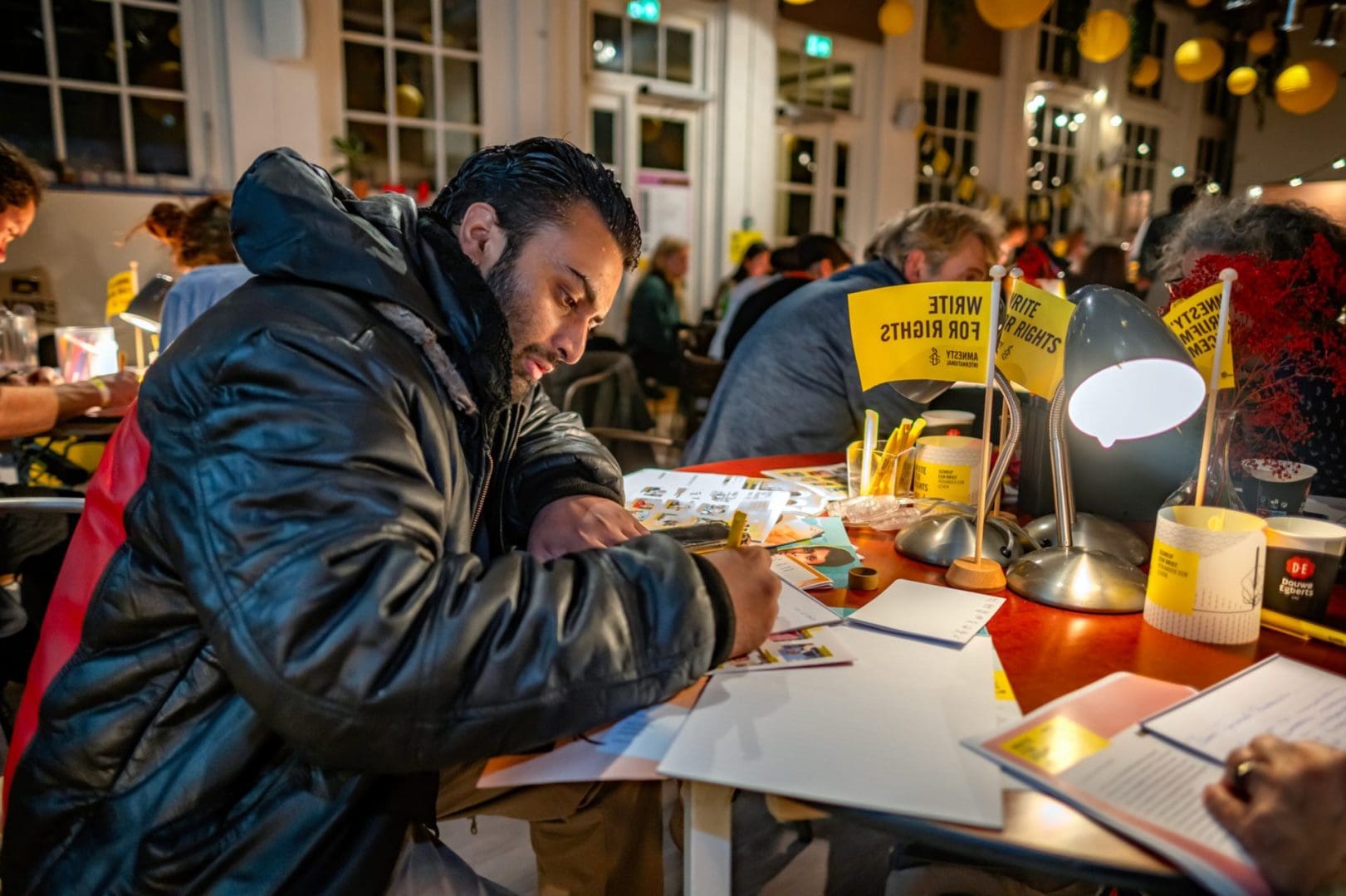 Amnesty Netherlands supporters and members take part in Write for Rights events at the organisations Amsterdam office, 10 December 2023