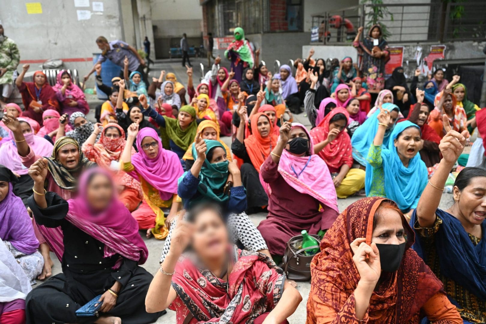 Garment workers from Opex Fashion Limited are staging a demonstration in front of the Department of Labor building in Dhaka, Bangladesh, on November 27, 2023, demanding their due payment. (Photo by Mamunur Rashid/NurPhoto via Getty Images)