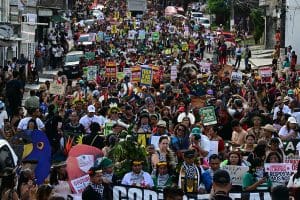 An aerial view of a group of protesters at COP30 in Brazil.