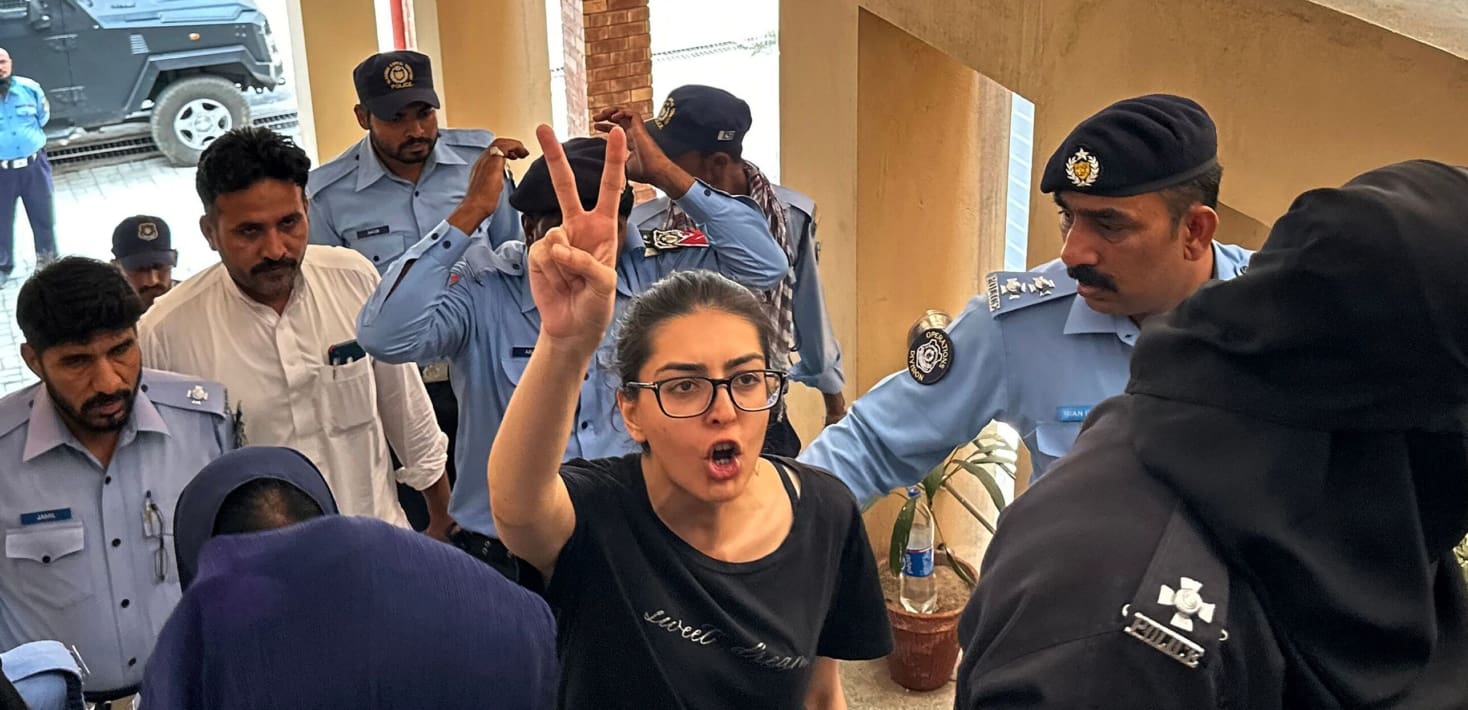 Imaan Mazari holds two fingers up in the 