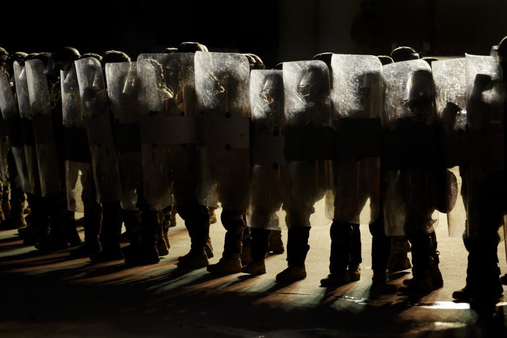 Los Angeles, CA - September 01: US National Guard stand outside the back entrance of the Edward R. Roybal Federal Building as demonstrators gather outside the building barricades to advocate for immigrant rights on Labor Day, Monday, Sept. 1, 2025 in Los Angeles, CA.