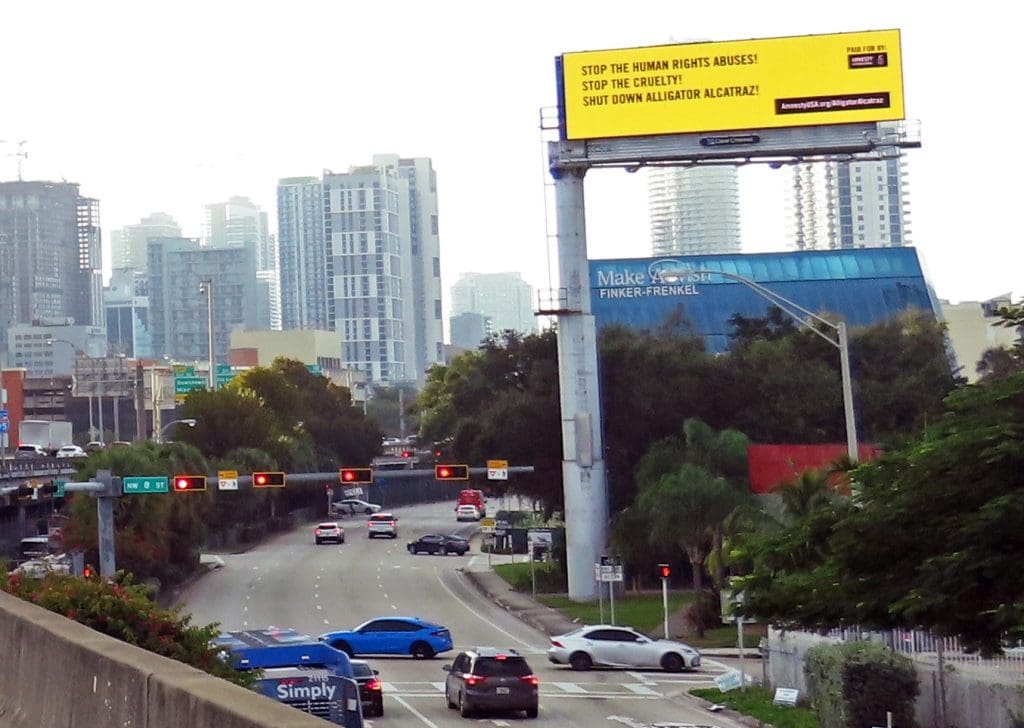 Amnesty International USA billboard against Alligator Alcatraz in Floride