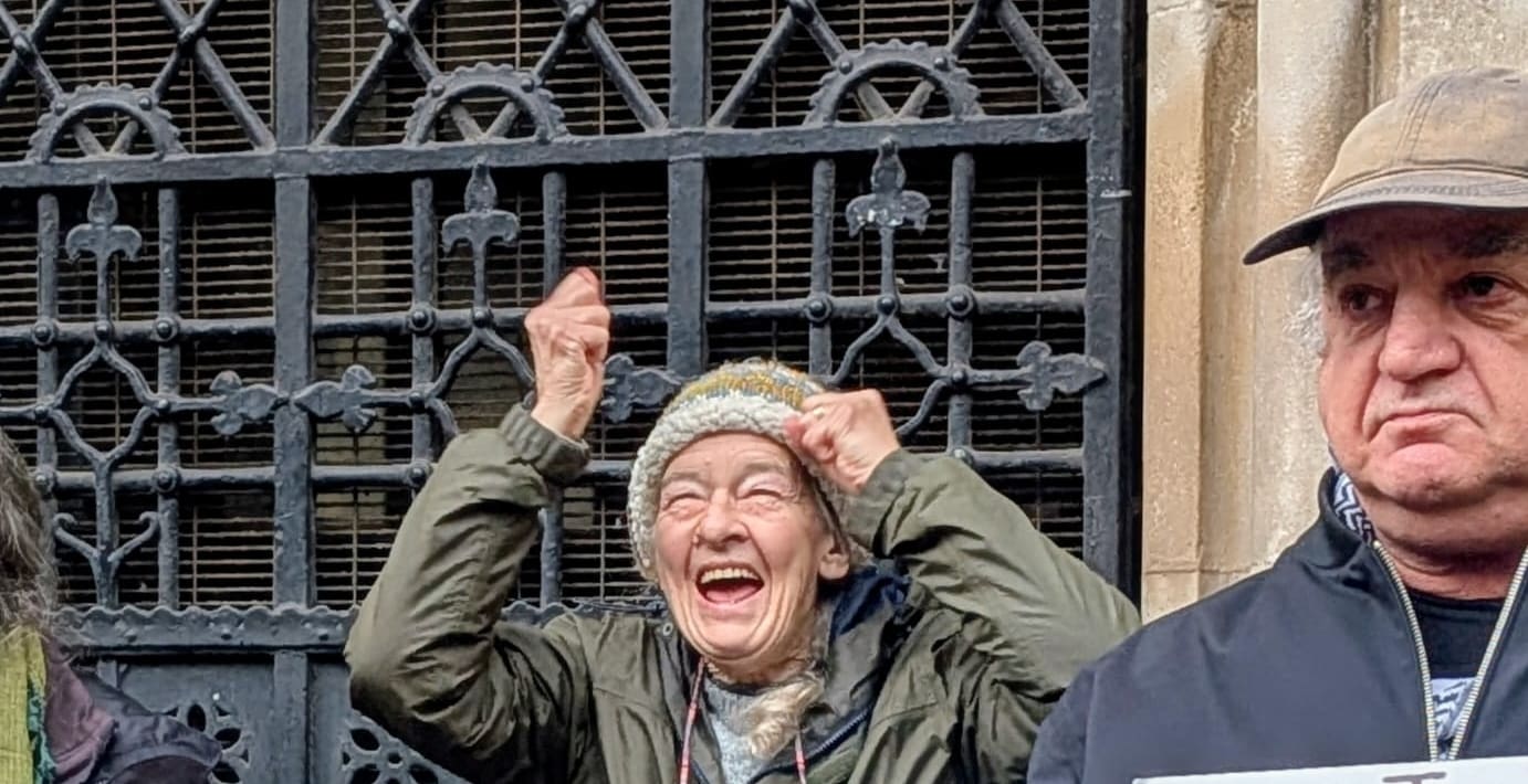 An older Caucasian gentleman cheering.