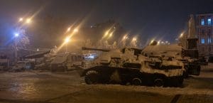 A military tank covered in snow.