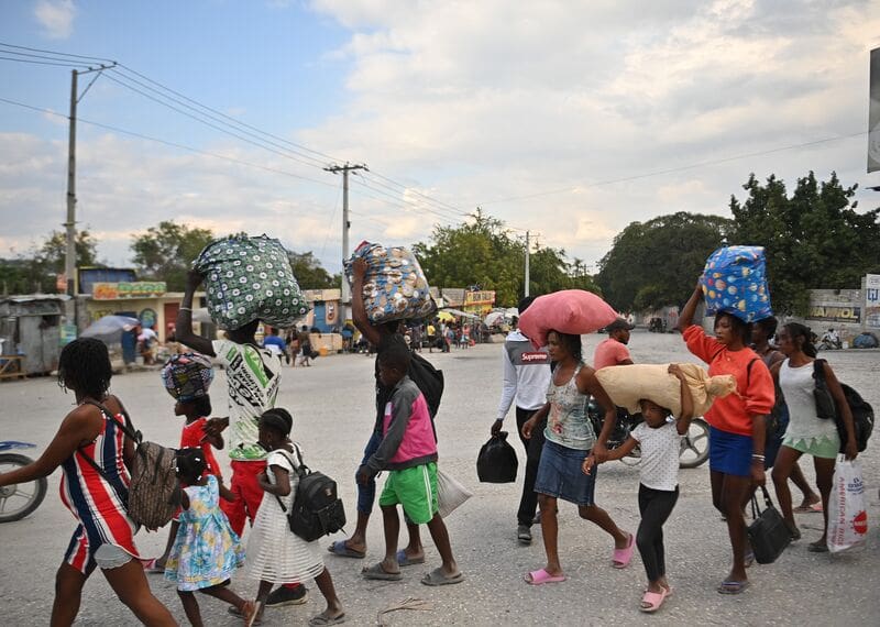 People flee gang violence in the Petion-ville neighborhood of Port-au-Prince, Haiti.
