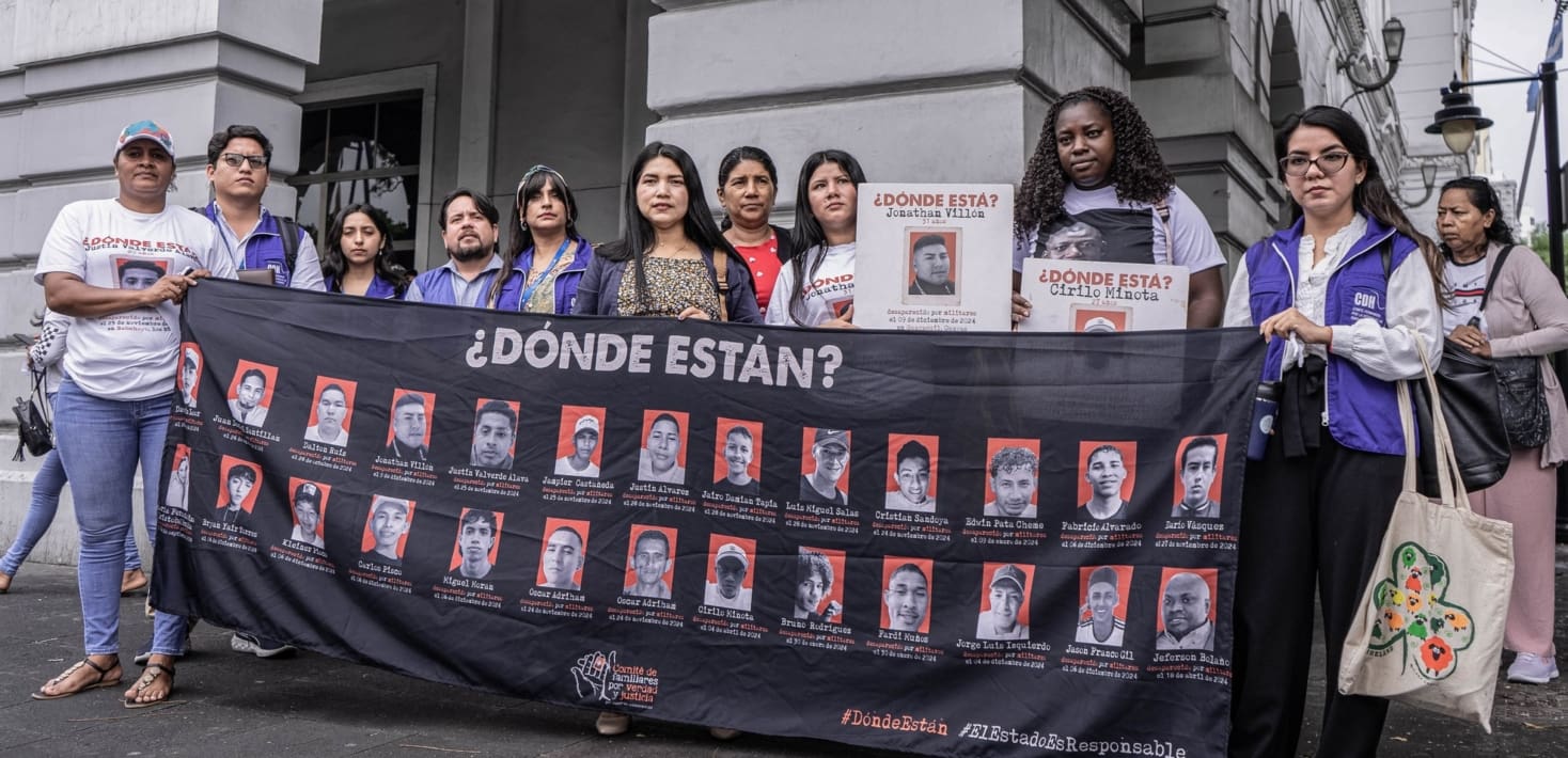 People with a banner that says 