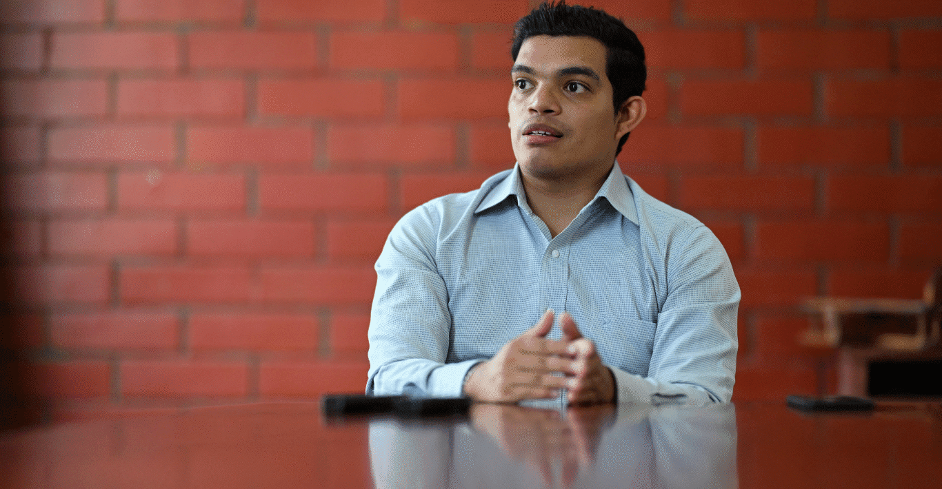 Fidel Zavala sitting in blue shirt