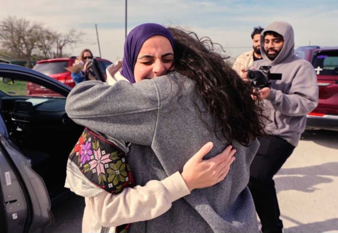 Leqaa Kordia hugging after being released