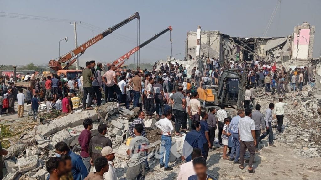 Aftermath of school strike. The distinctive pancaking of the roof is evidence of a top-down air strike which destroyed much of the school building.