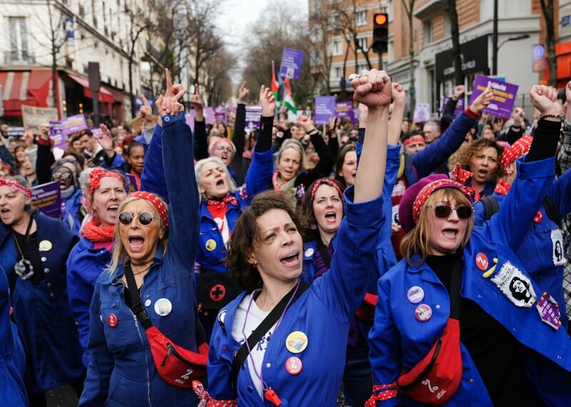 Members of the feminist collective “Les Rosies” march in celebration of International Women’s Day in Paris.
