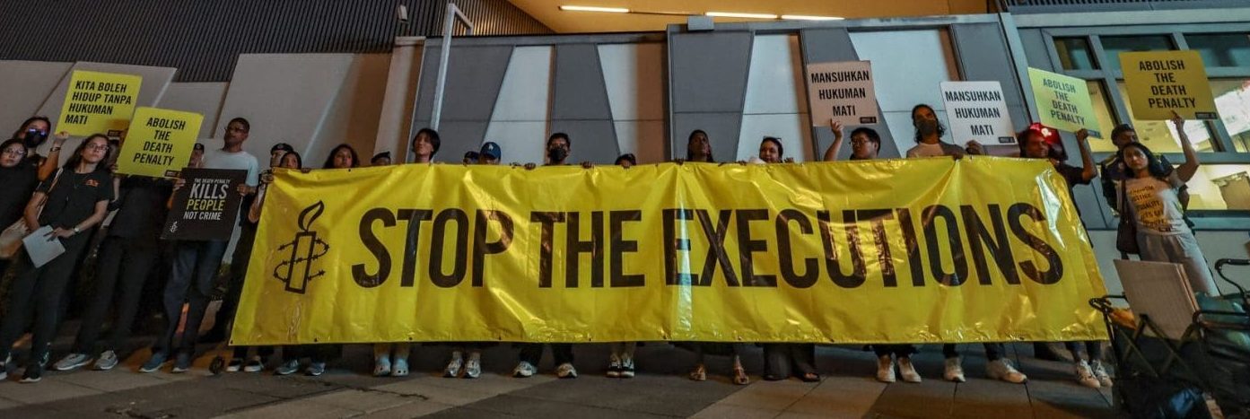 Amnesty International activists hold a banner in solidarity with Pannir Selvam, a Malaysian man awaiting execution for drug trafficking, outside Singapore's embassy in Kuala Lumpur, Malaysia, on May 6, 2025.
