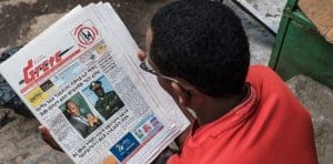 person reading the paper