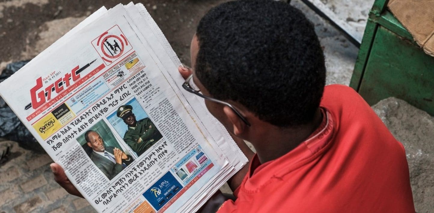 person reading the paper