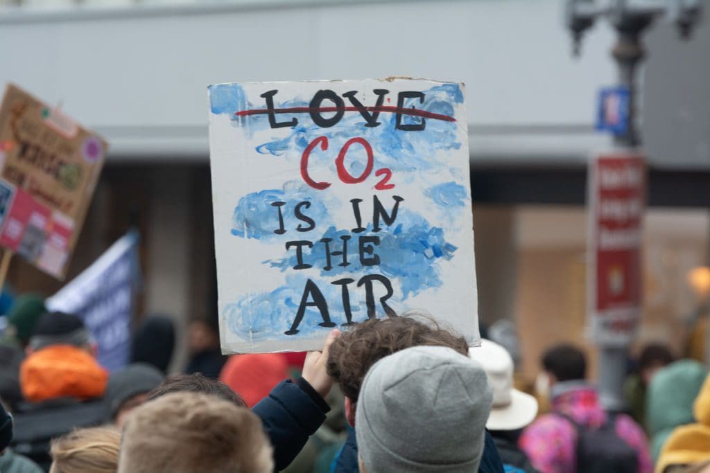 A protester placard that reads 