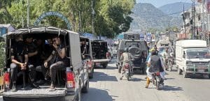 Cars, trucks, and motorbikes in traffic in Pakistan.