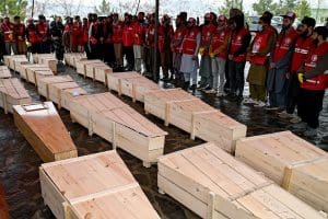 Several wooden coffins on the ground.
