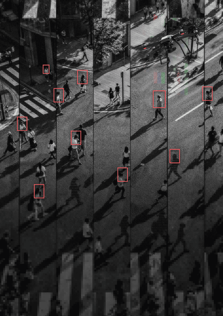 image from drone looking on people in a street with red boxes around some people