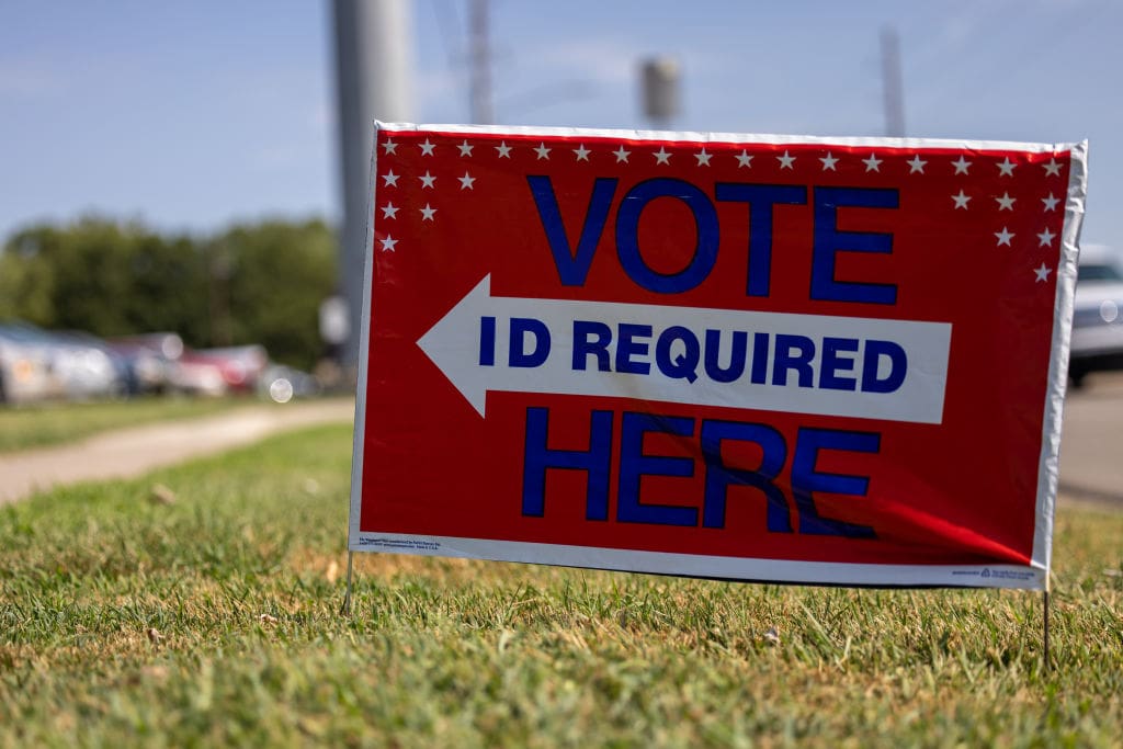 a lawn sign that reads 