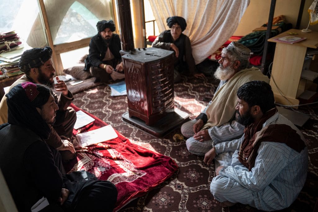 head of the penal court Mohammad Mobin listens to a man who has been sentenced to death for murder, during a hearing at the Ghazni Court of Appeal in Ghazni, eastern Afghanistan.