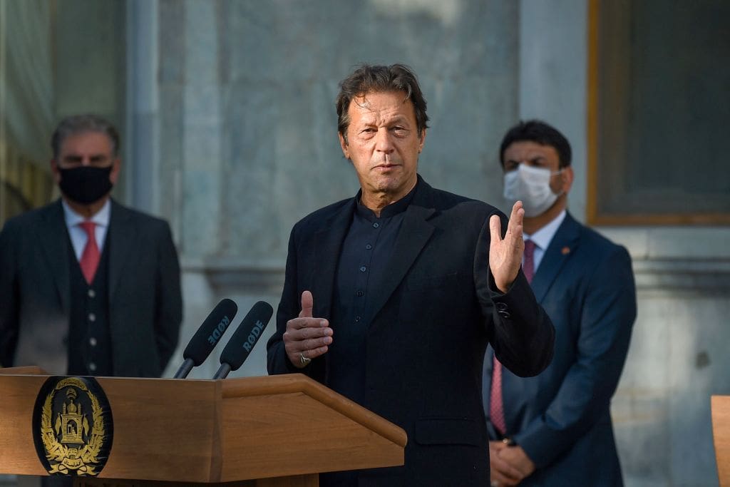 An older gentlemen speaking at a podium