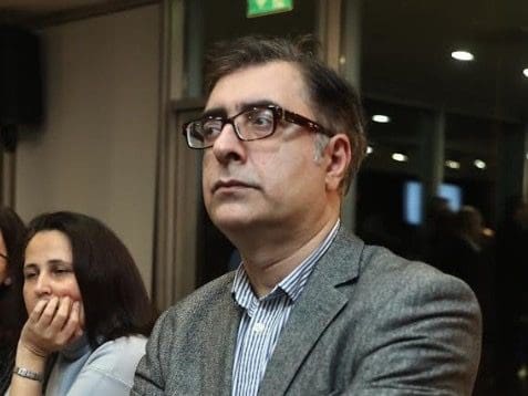 Middle aged man with glasses