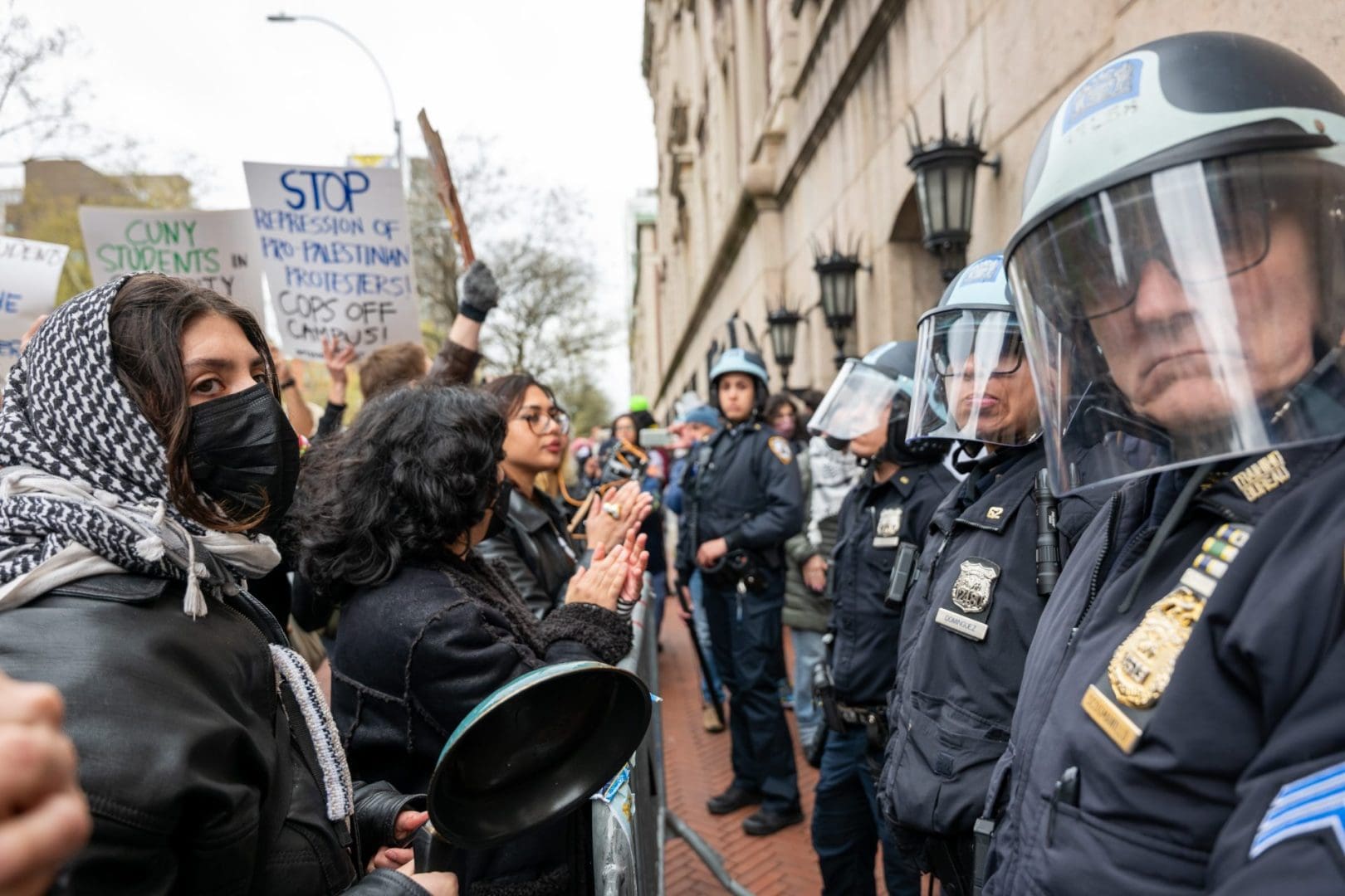 NEW YORK, NEW YORK - APRIL 18: Students and pro-Palestinian activists face police as they gather outside of Columbia University