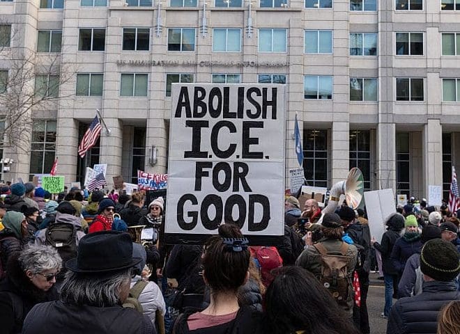 WASHINGTON, DISTRICT OF COLUMBIA, UNITED STATES - 2026/01/11: An activist holds a sign reading "Abolish ICE for Good" during a march to the headquarters of U.S. Immigration and Customs Enforcement (ICE) in Washington, DC. The demonstration is part of nationwide protests sparked by the fatal ICE shooting of Renee Good in Minneapolis.