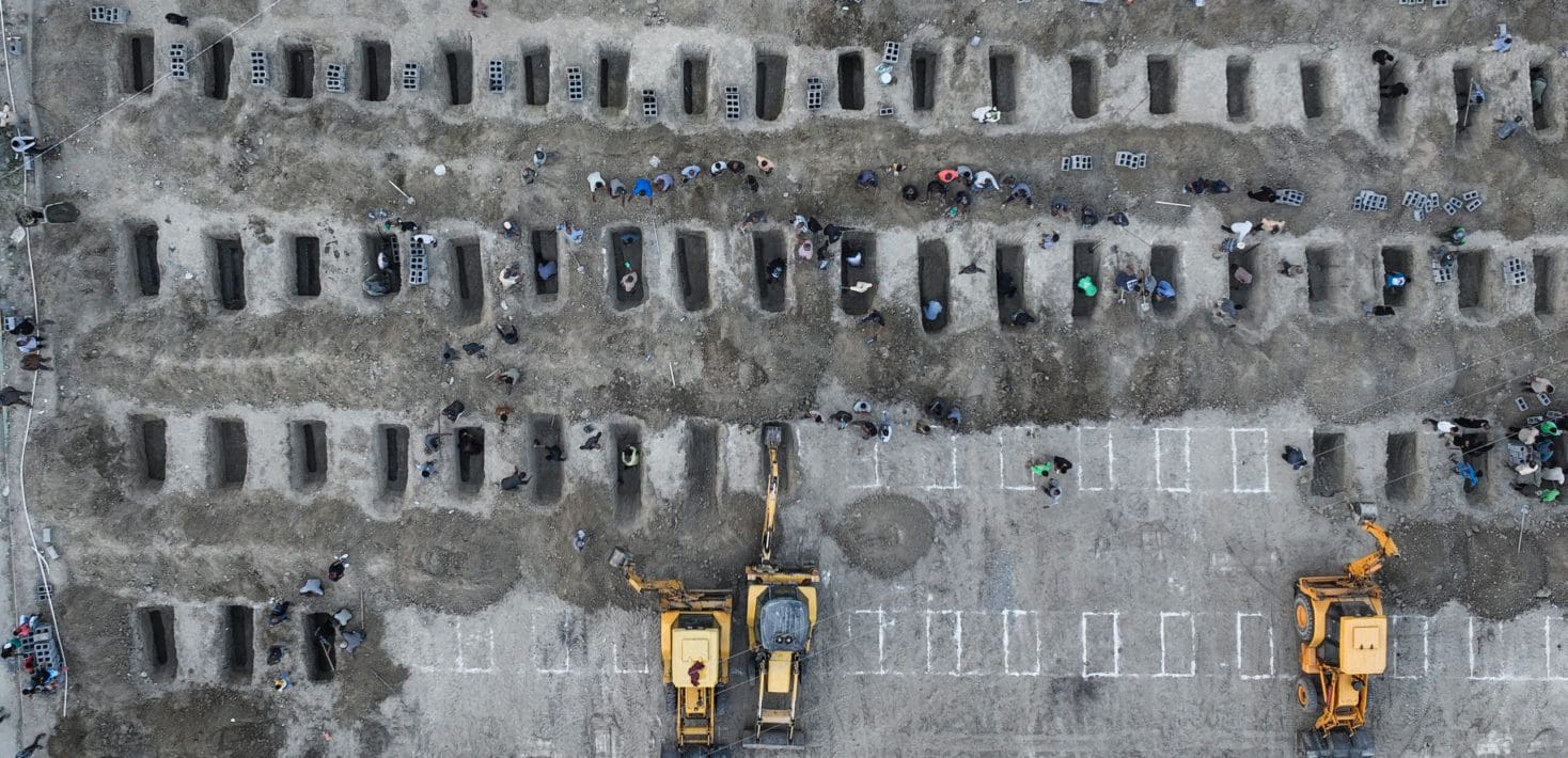 Rows of graves in the gray earth.