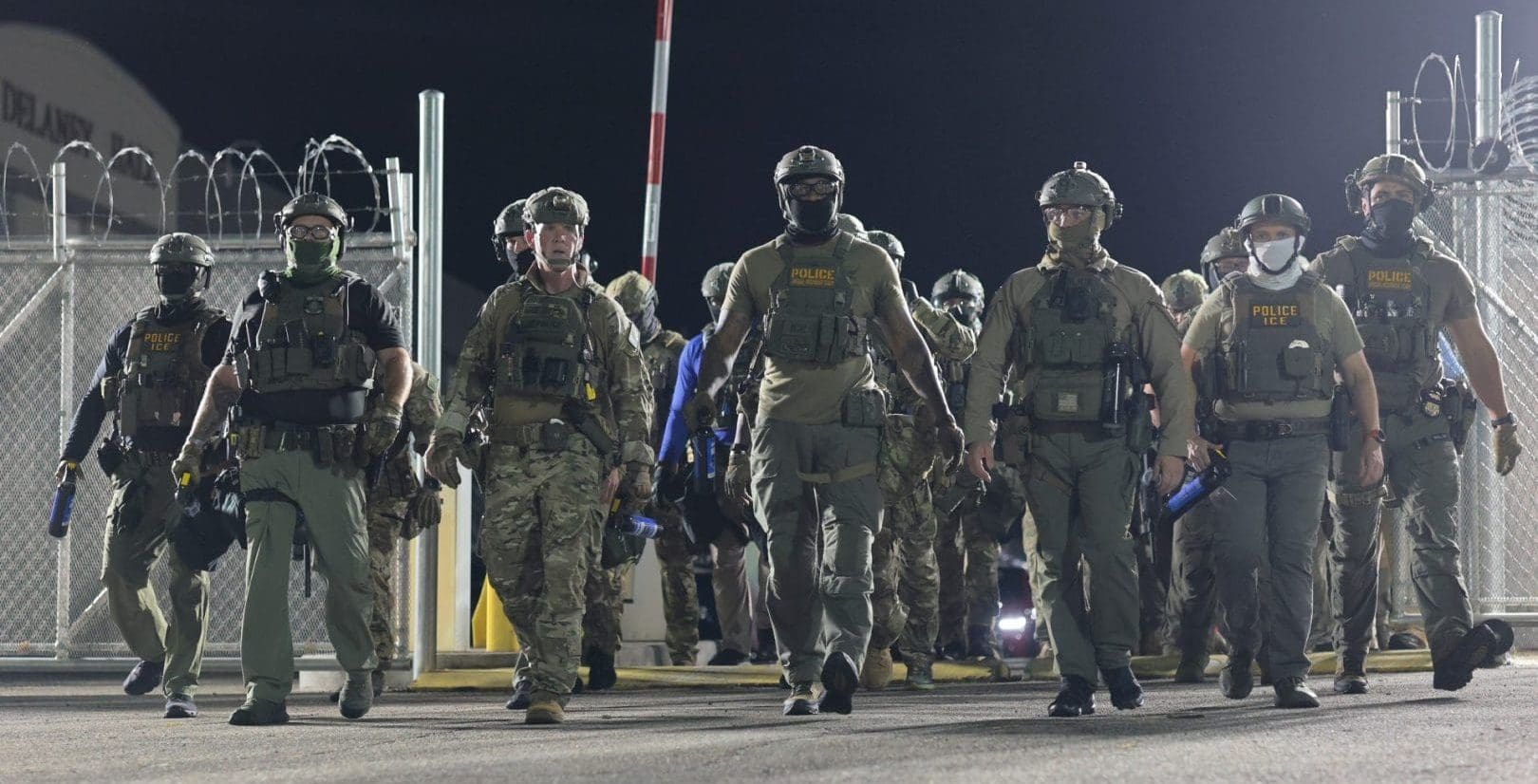 Homeland Security Investigations (HSI) and Immigration and Customs Enforcement (ICE) arrive to push protesters back as cars enter and leave the Delaney Hall Immigration Detention Center on June 12, 2026 in Newark, New Jersey