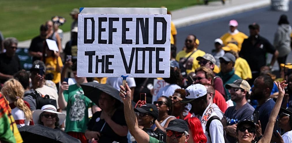 WASHINGTON, D.C., UNITED STATES - AUGUST 28: Demonstrators gather on the National Mall during a 'Defend the Vote' rally marking the 63rd anniversary of the 1963 March on Washington in Washington, DC, on August 28, 2026. Thousands of demonstrators are expected to attend the rally to defend voting rights and commemorate the historic march led by civil rights leader Martin Luther King Jr.
